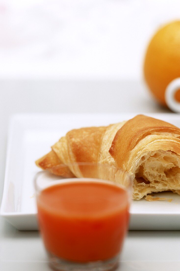 Croissant and carrot juice