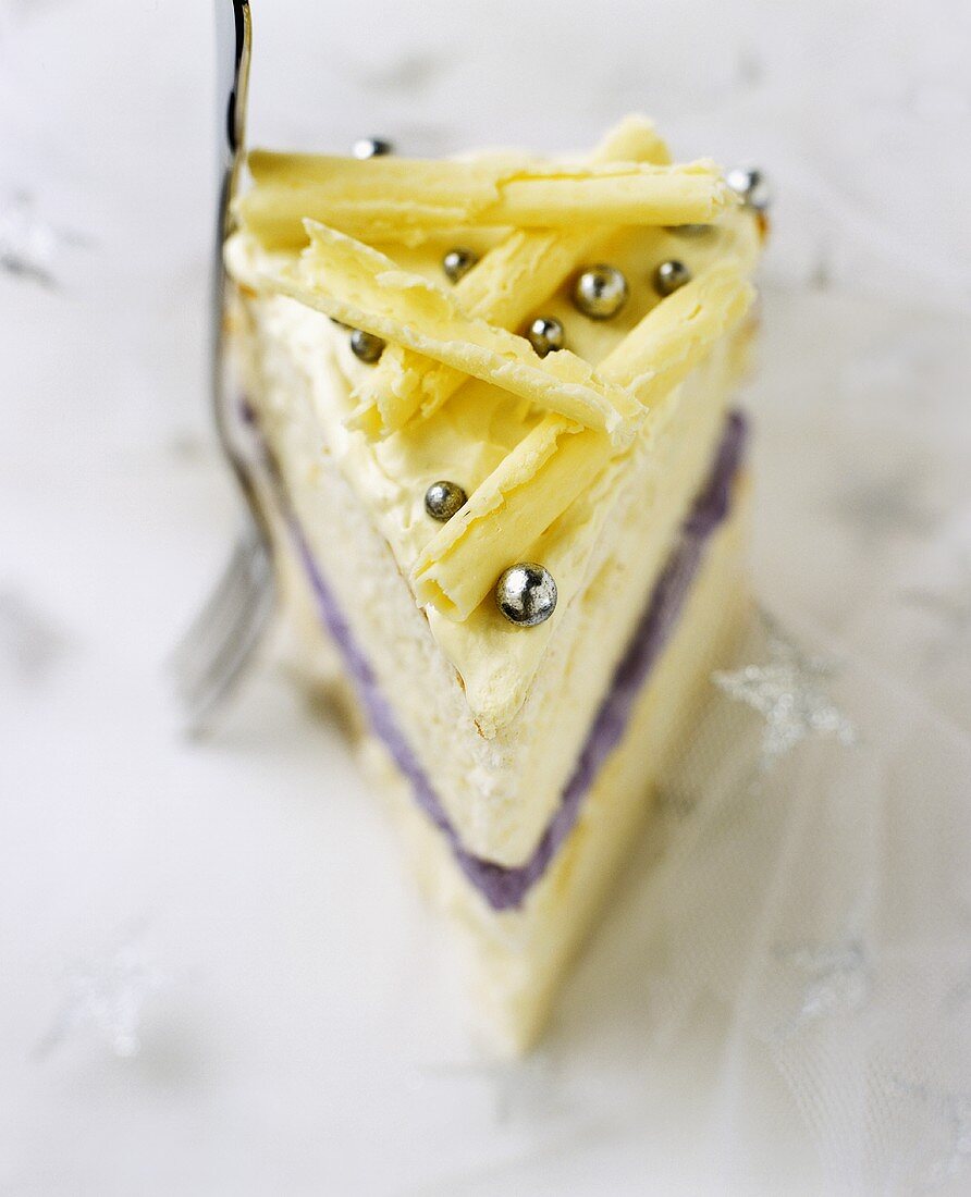 A piece of white chocolate and lavender cake