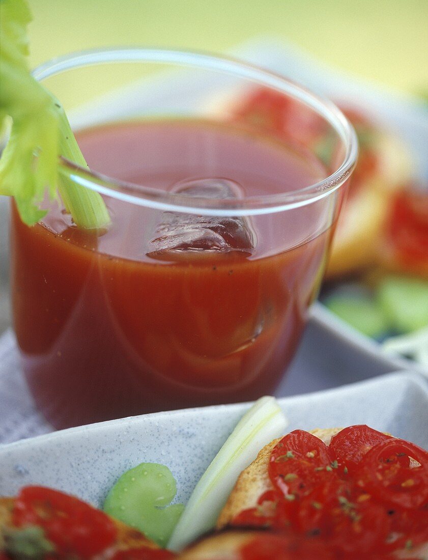 Bloody Mary in glass, garnished with stick of celery
