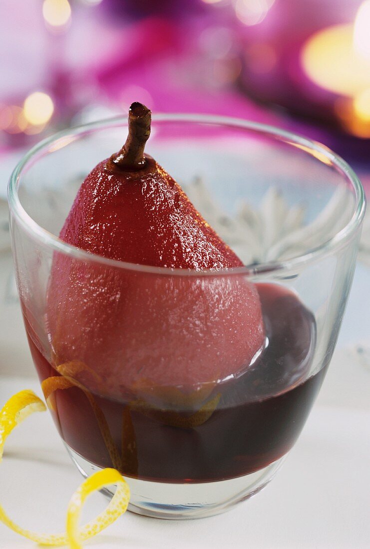 Red wine pear, served in a glass