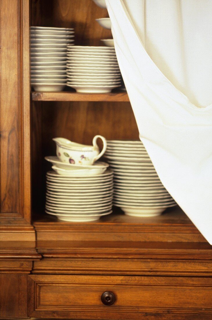 Crockery in kitchen cupboard