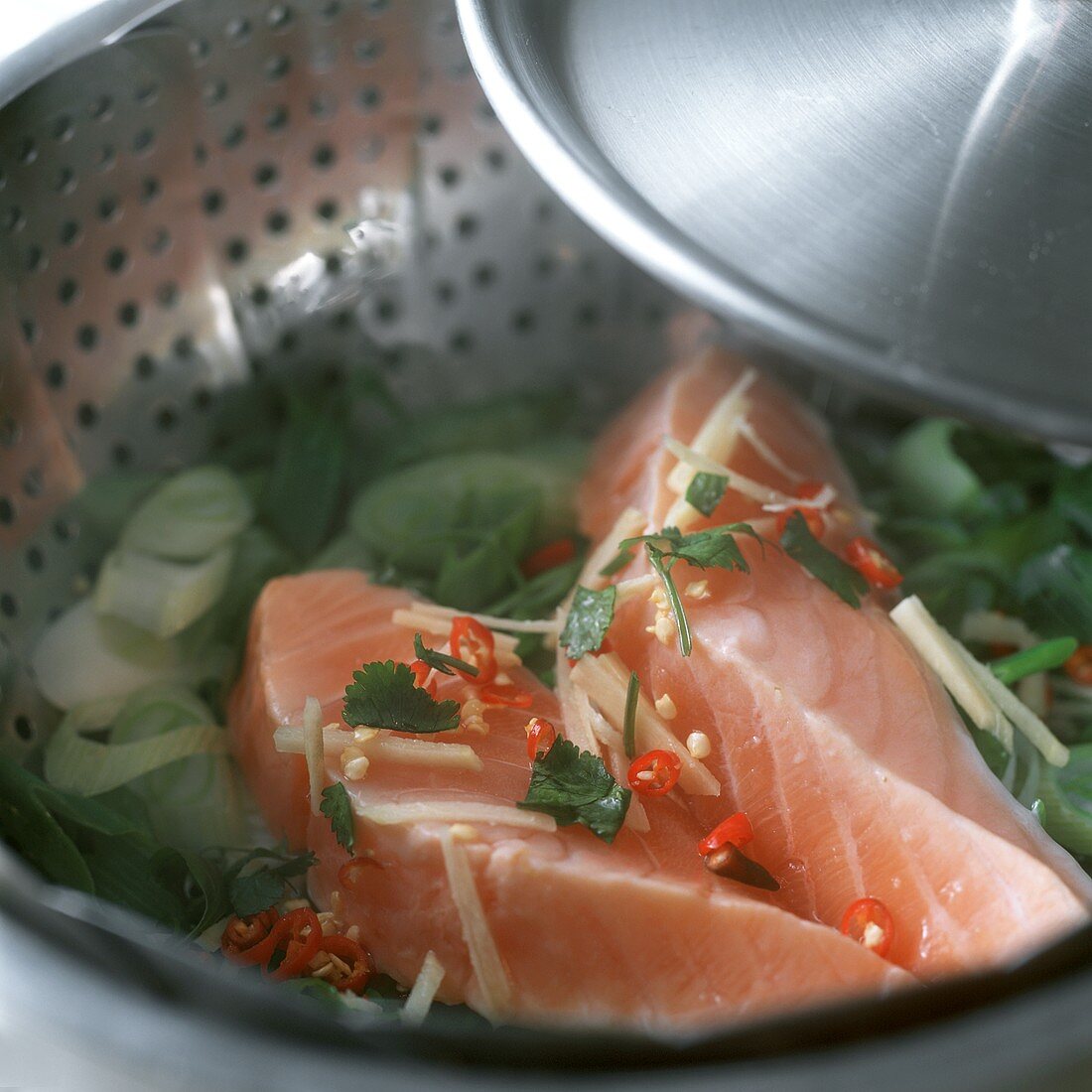 Steaming tuna & vegetables in steaming pan with strainer insert