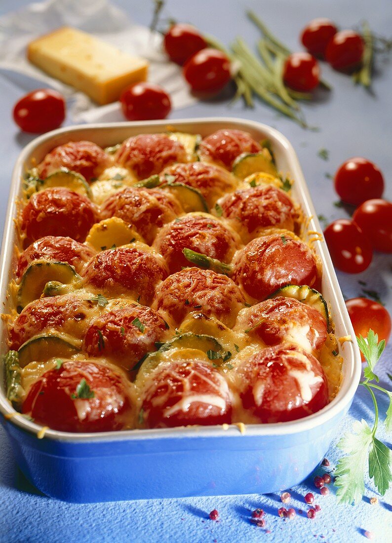 Courgette and potato bake with whole unpeeled tomatoes