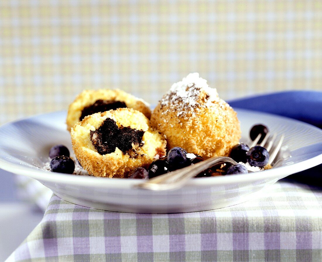 Poppy seed dumplings with marinated blueberries