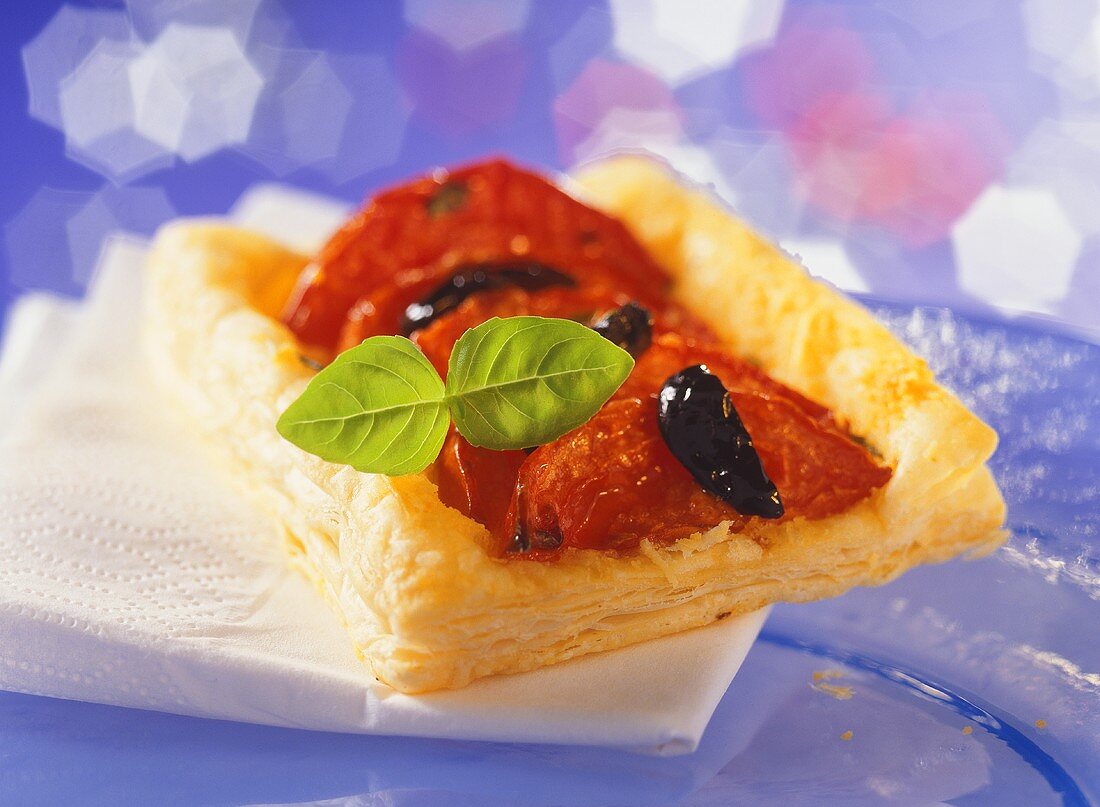 Puff pastry slices with tomatoes and olives