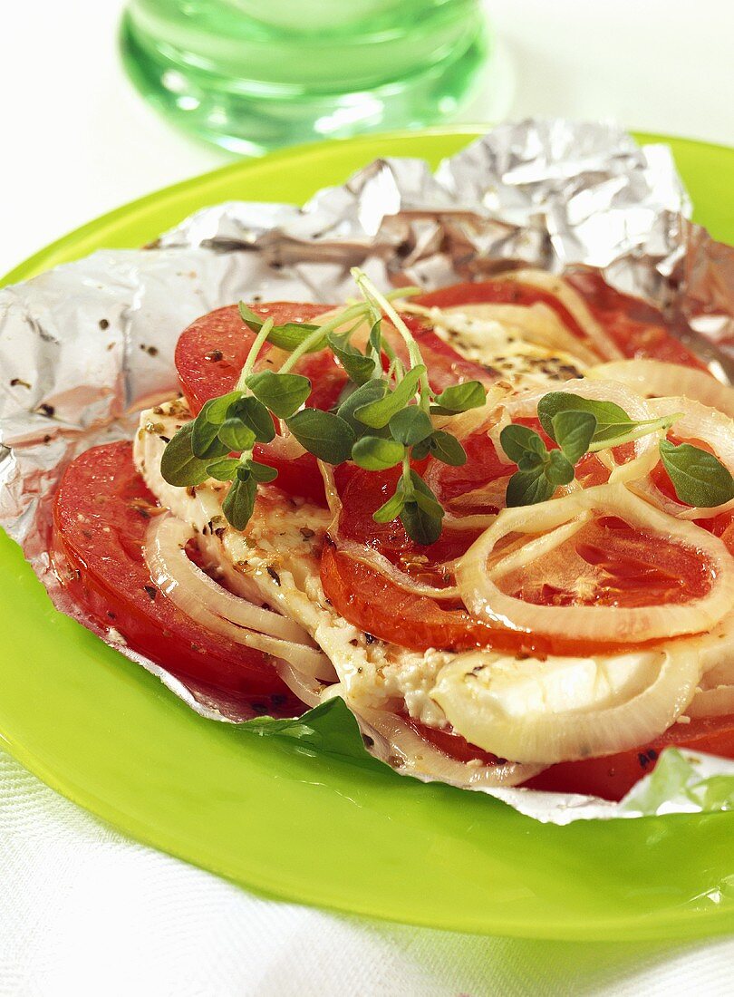 Tomatoes with sheep's cheese baked in foil