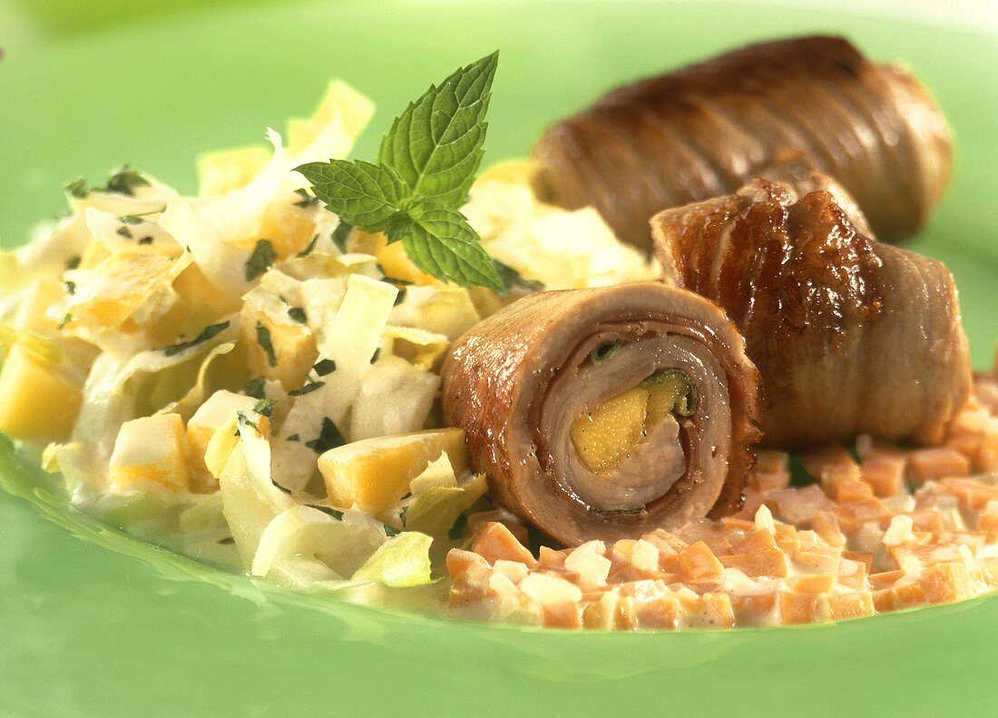 Veal rolls with mango stuffing, carrots & mango & chicory salad