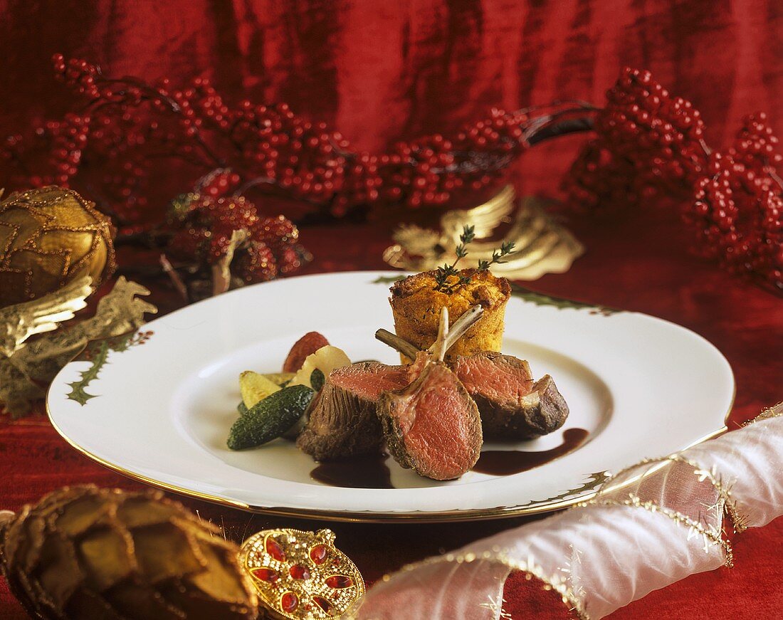 Saddle of lamb with vegetables & tomatoes on Christmas plate