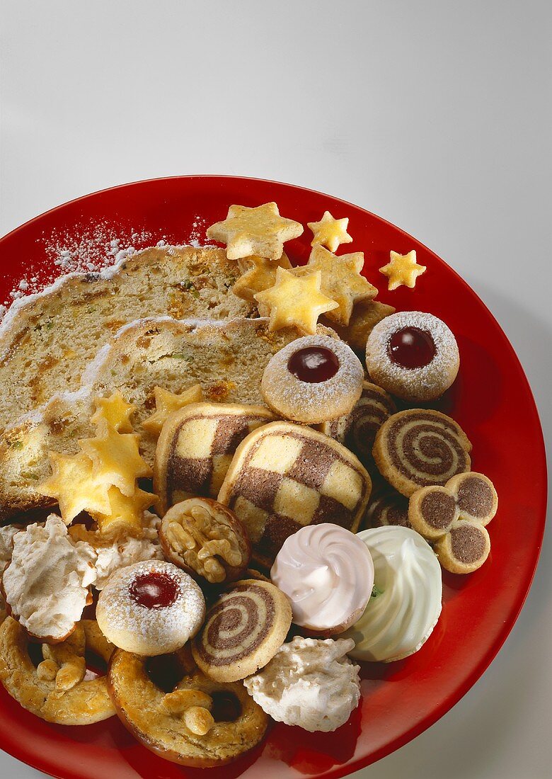 Colourful plate with assorted biscuits and stollen