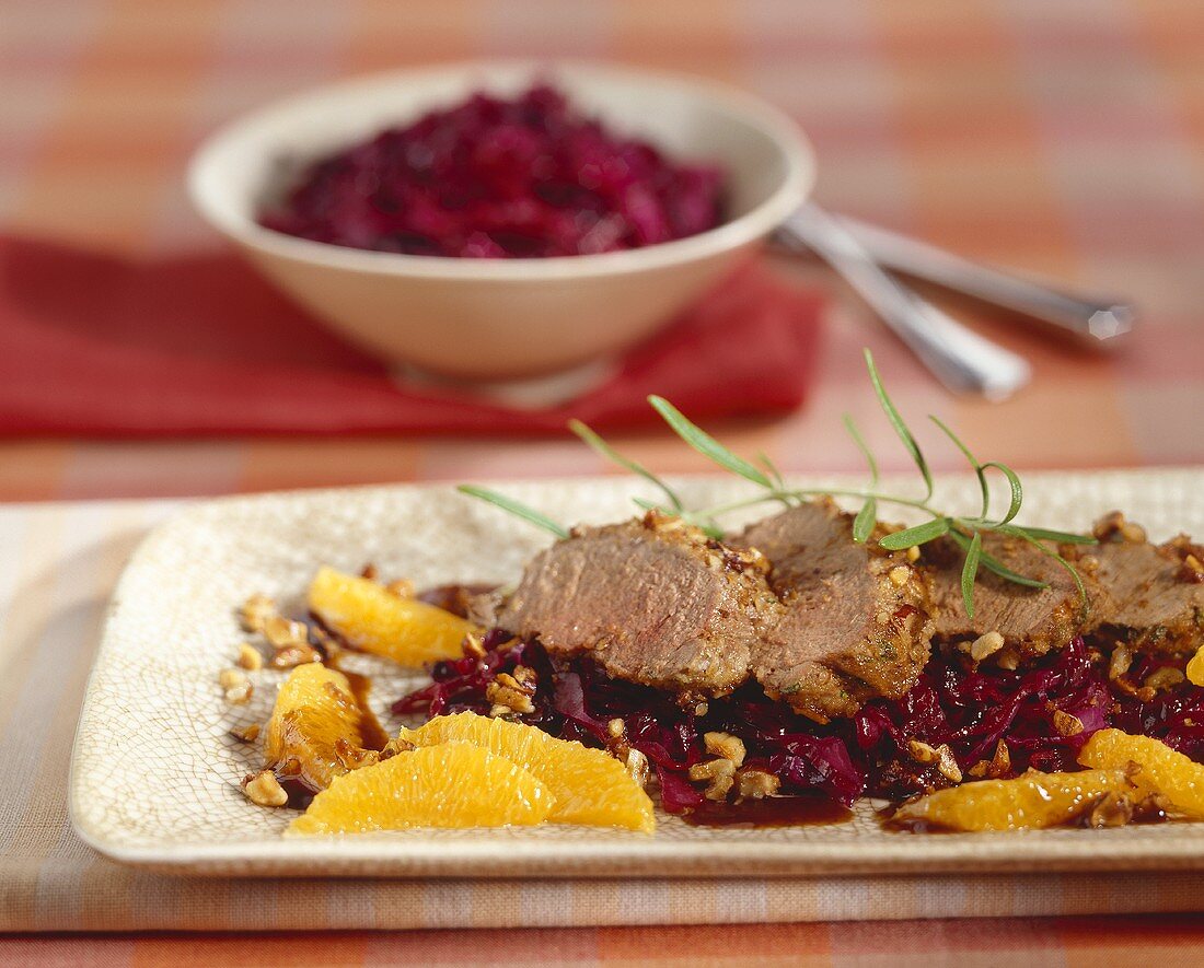 Venison fillet with hazelnut crust on red cabbage with oranges