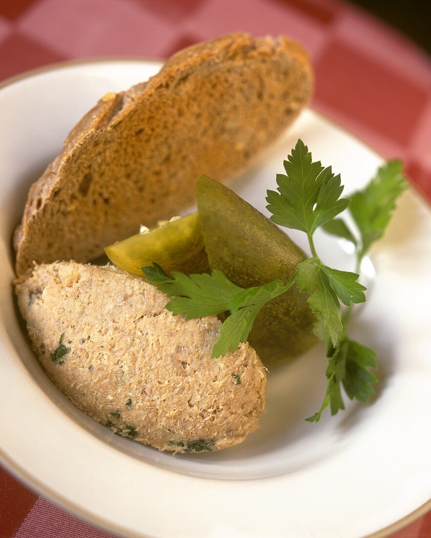 Duck rillettes, pieces of pickled gherkins and bread
