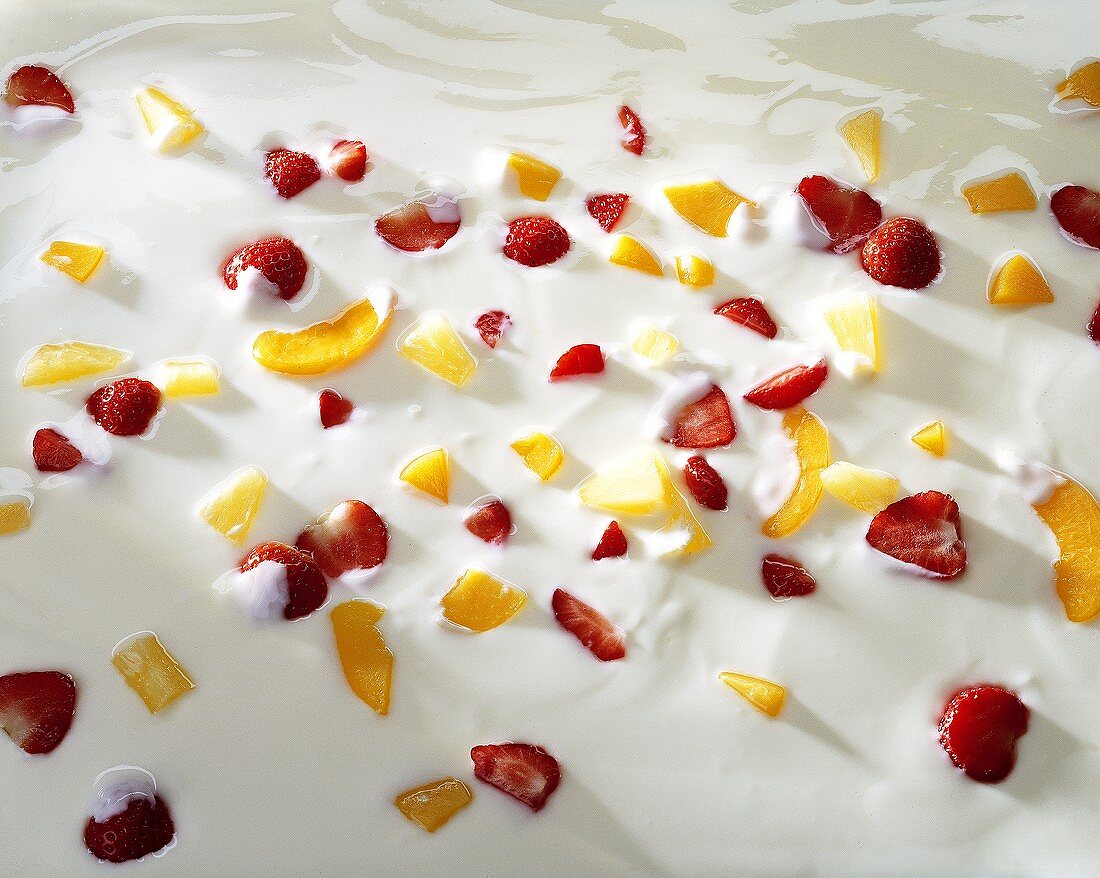 Yoghurt with pieces of fresh strawberry and fruit