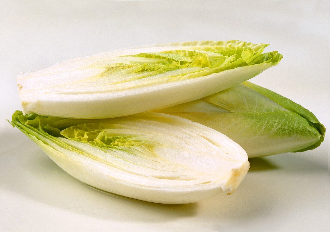 One whole and one halved chicory
