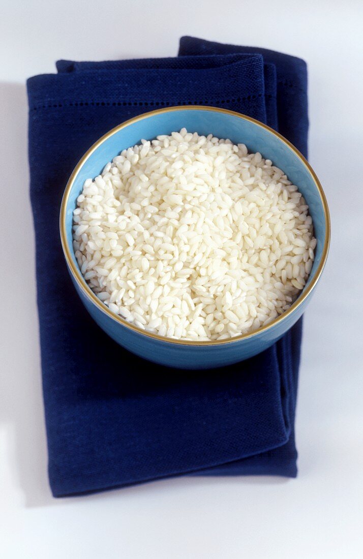 Risotto rice in a blue bowl