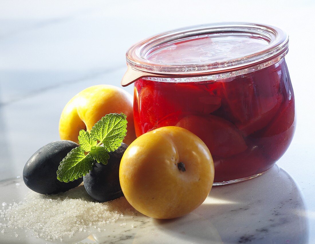 Bottled plums in a jar