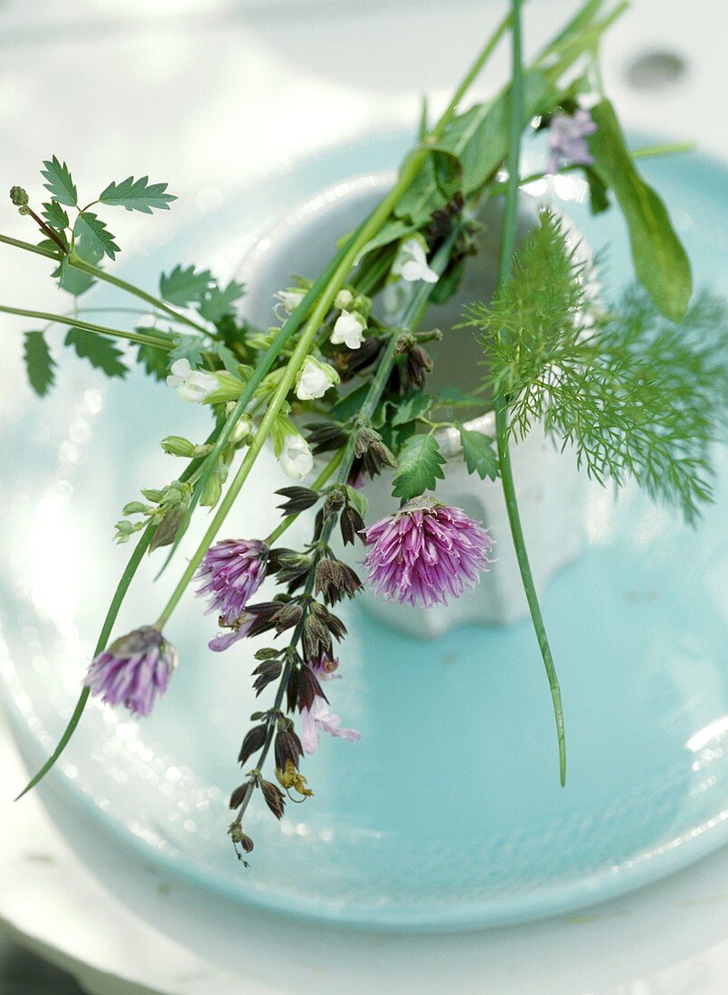 Arrangement of herbs on a place setting