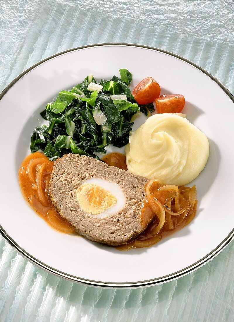 Mock hare (meatloaf) with onion sauce, chard, mashed potato