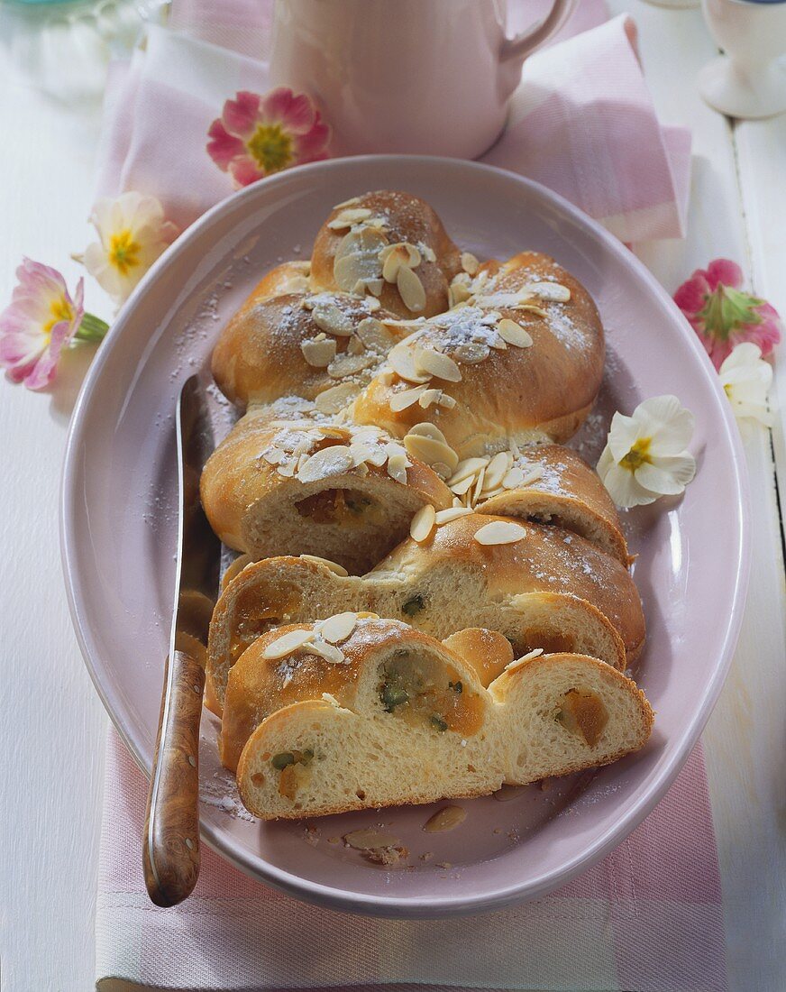 Bread plait with marzipan and apricots, slices cut