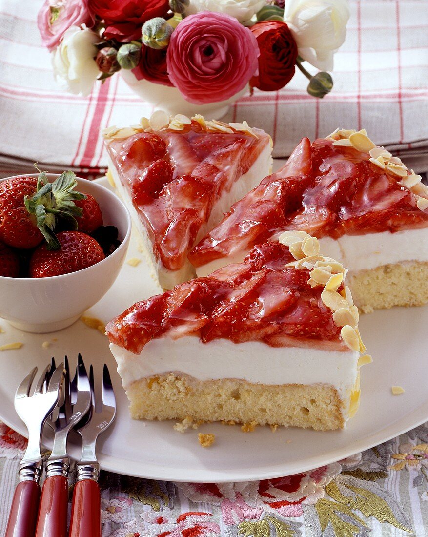 Three pieces of curd cheese cake with strawberries