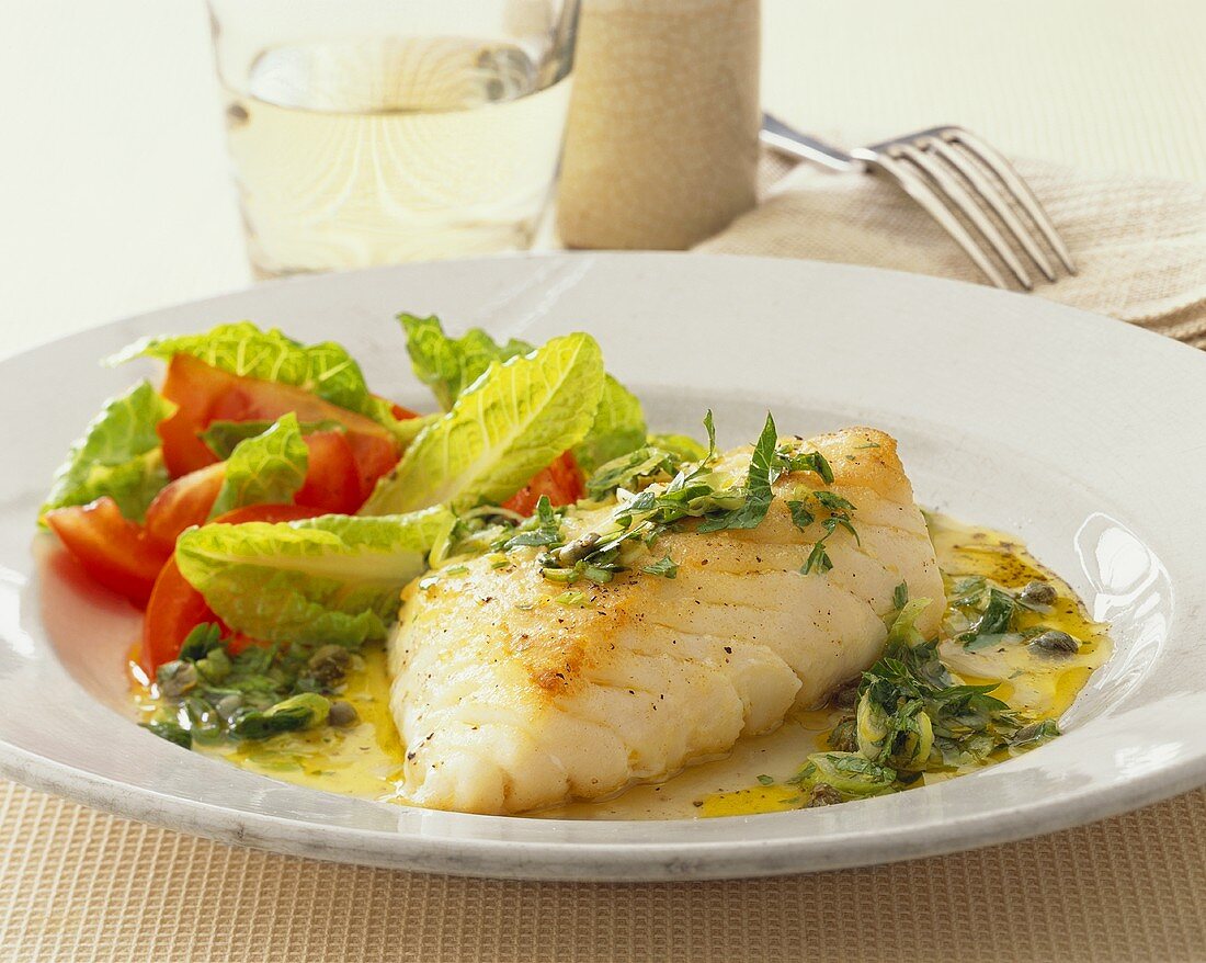 Cod fillet with lemon and herb sauce and salad