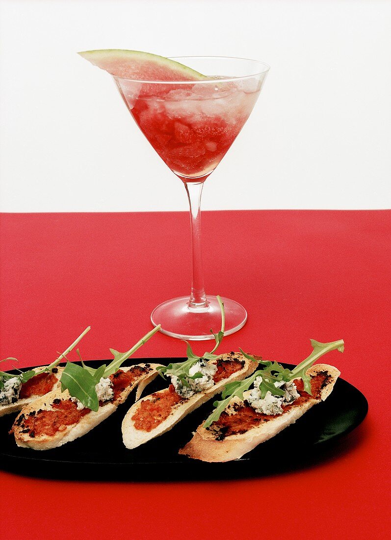 Toasted bread with red pesto and goat's cheese, cocktail