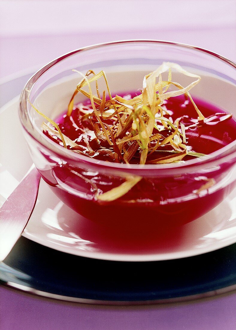 Beetroot bouillon with deep-fried leeks