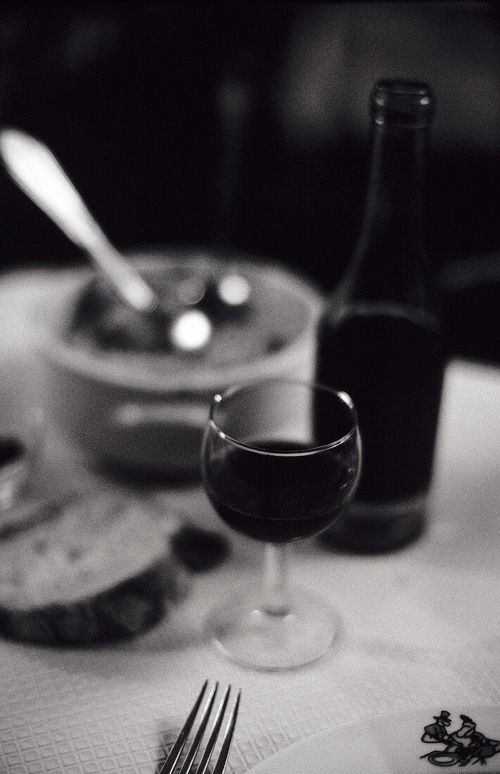 Red wine, glass in a 'Bouchon lyonnais' (simple bistro, Lyon)