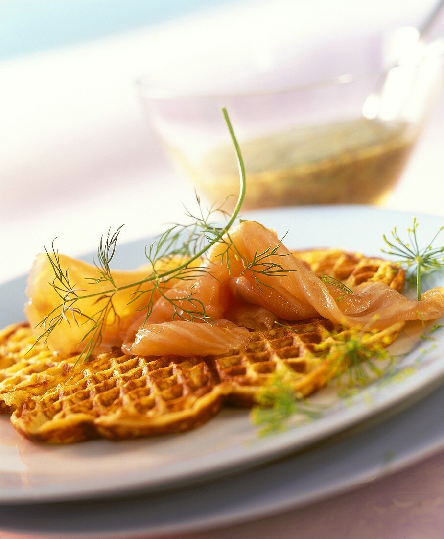 Potato waffle with salmon and mustard and dill sauce