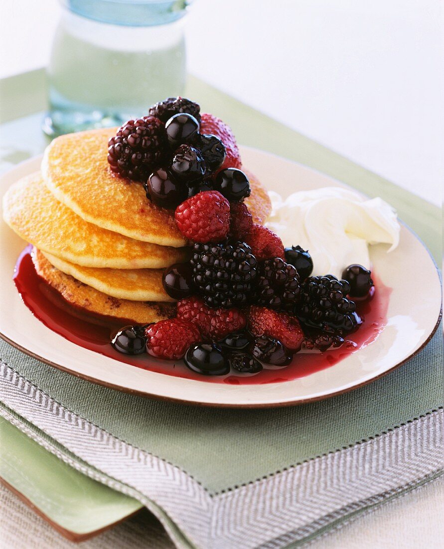 Pancakes with berry rumtopf and cream