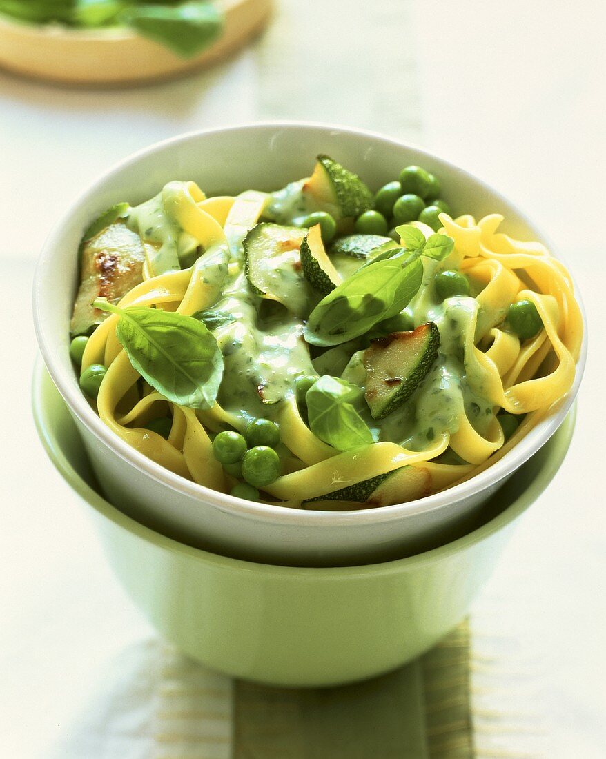 Tagliatelle with courgettes, peas and basil cream