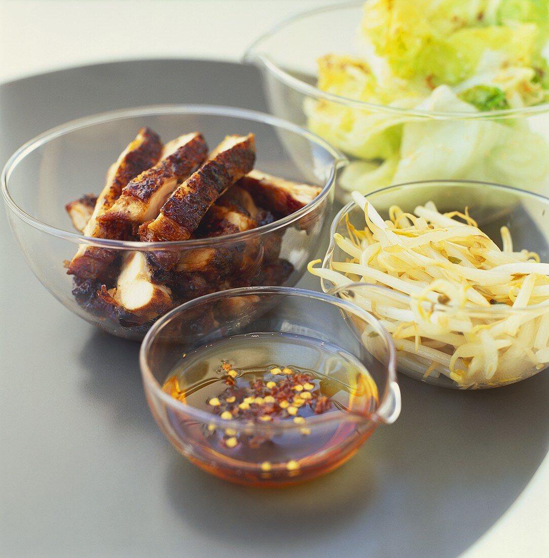 Honeyed chicken breast strips with chili sauce & soya sprouts