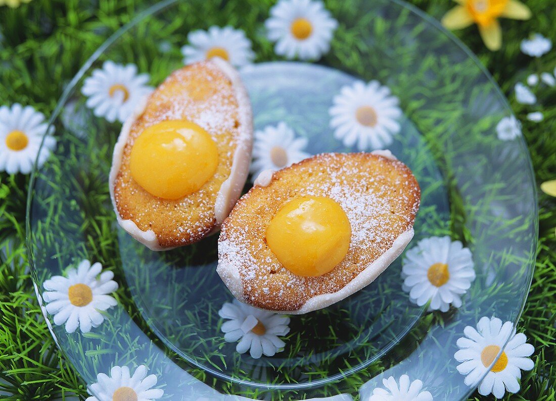 Two small egg cakes (sponge buns with lemon curd cream)