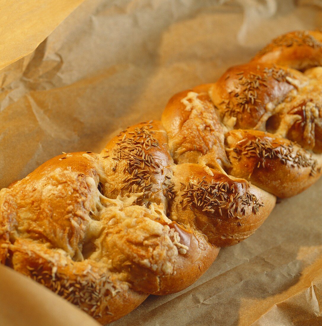 Three-grain bread plait with caraway and cheese