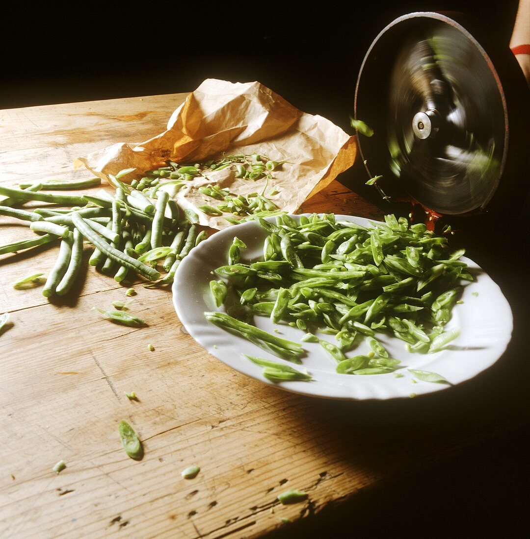 Slicing green beans with a bean slicer