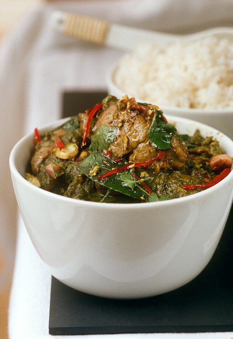 Green chicken curry and a bowl of rice