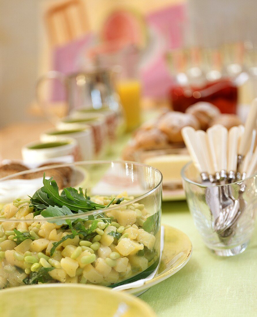 Potato and bean salad with rocket on buffet table