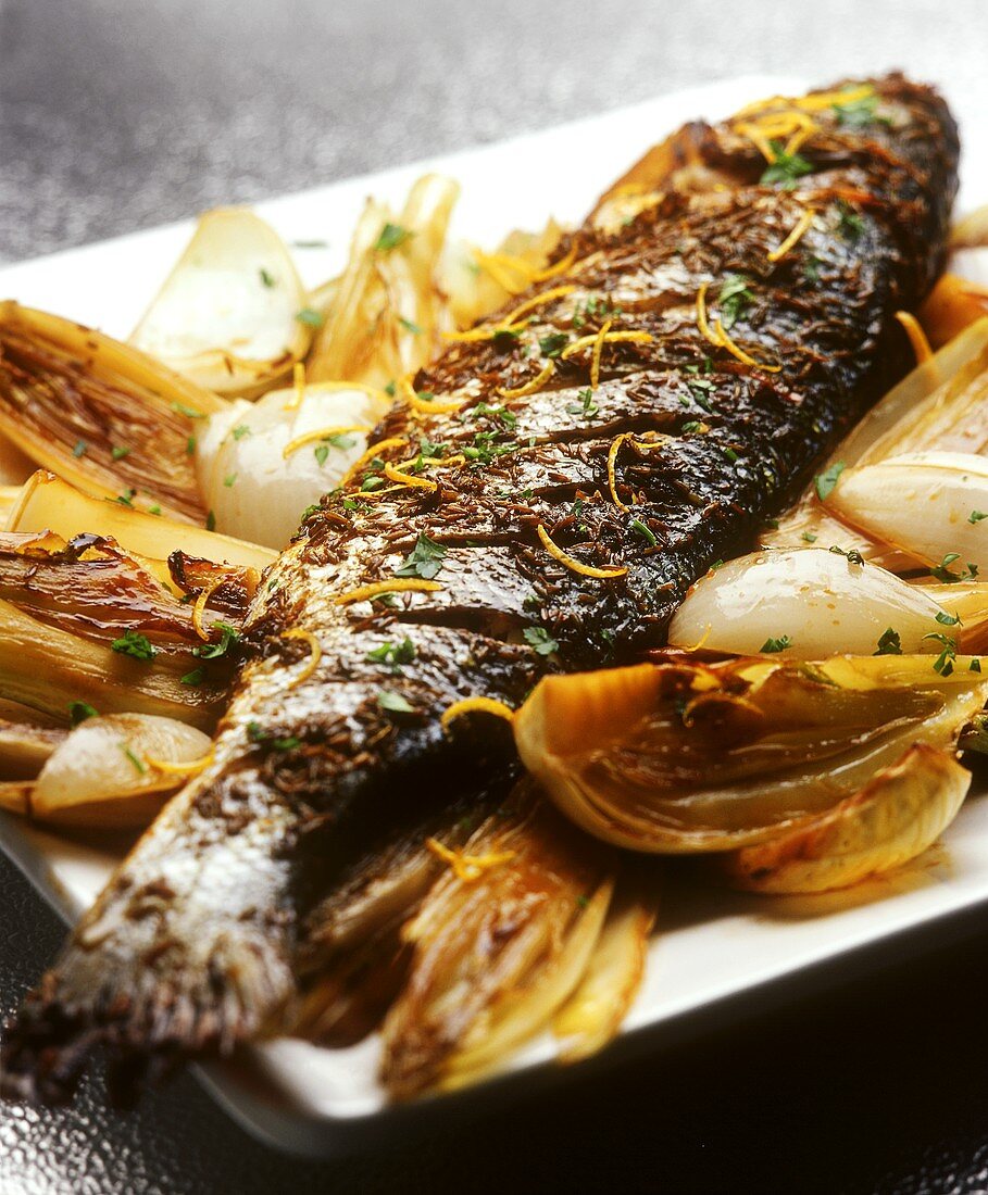 Baked trout on baked vegetables