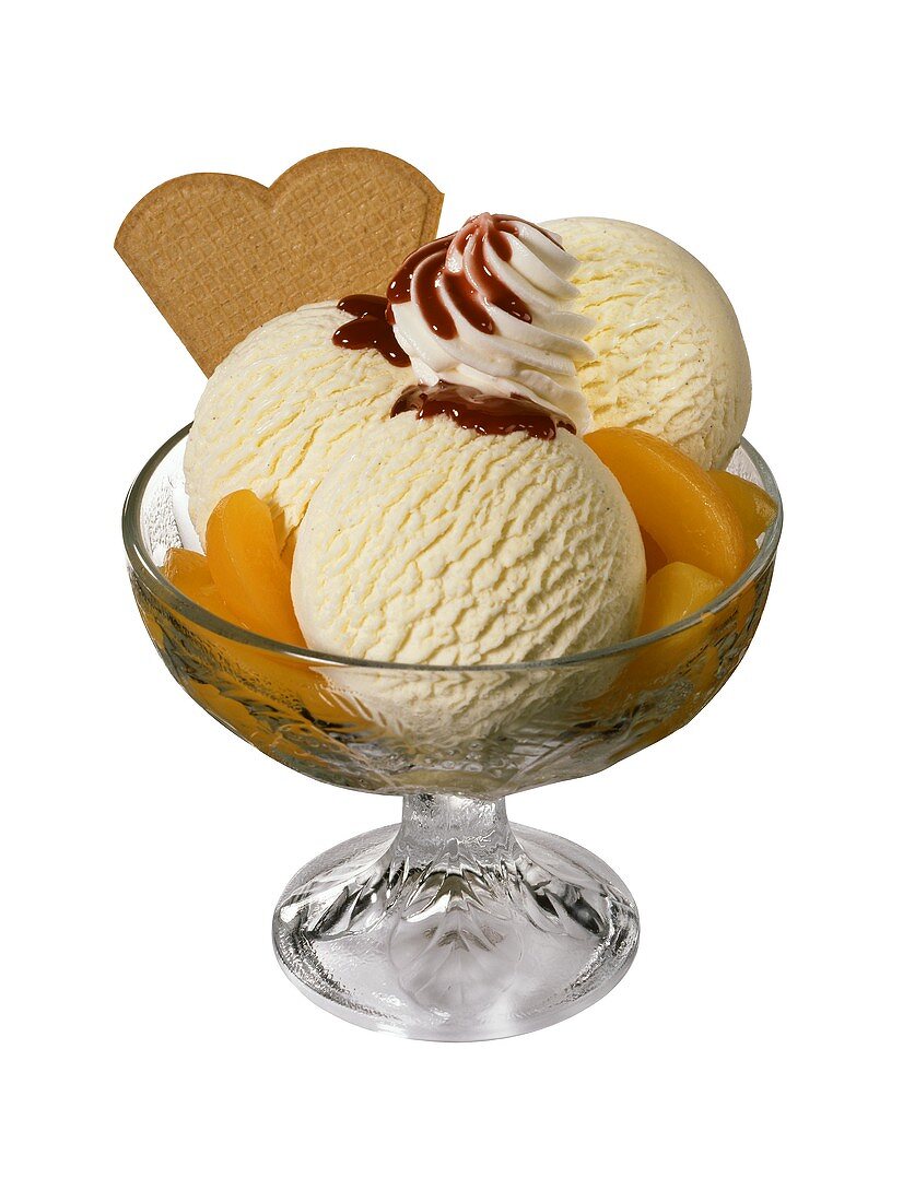 Sundae: vanilla ice cream, peaches, cream & strawberry sauce