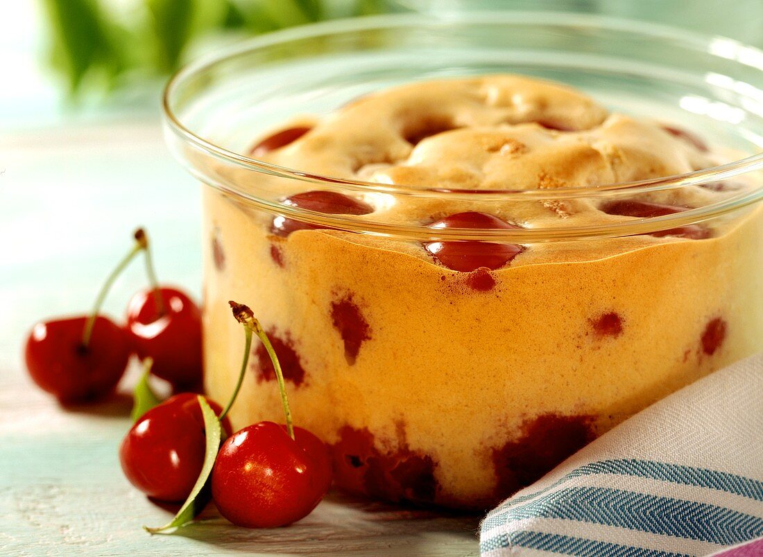 Clafouti with cherries in a glass dish