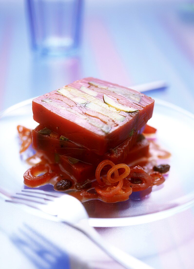 Mediterranean vegetable terrine on red wine onion-raisin sauce