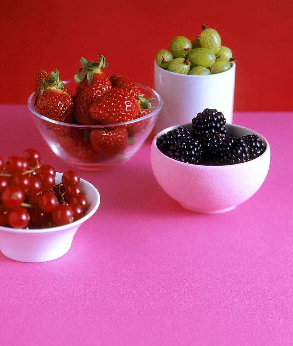 Redcurrants, blackberries, gooseberries & strawberries in bowls