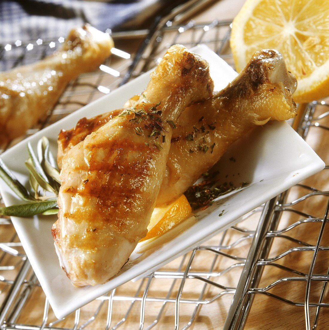 Barbecued chicken legs with herbs and lemon