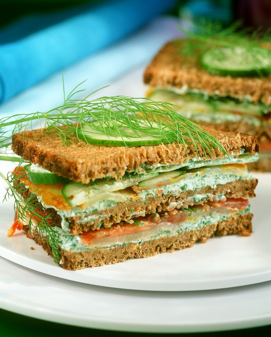 Wholemeal herb spread and smoked fish sandwiches
