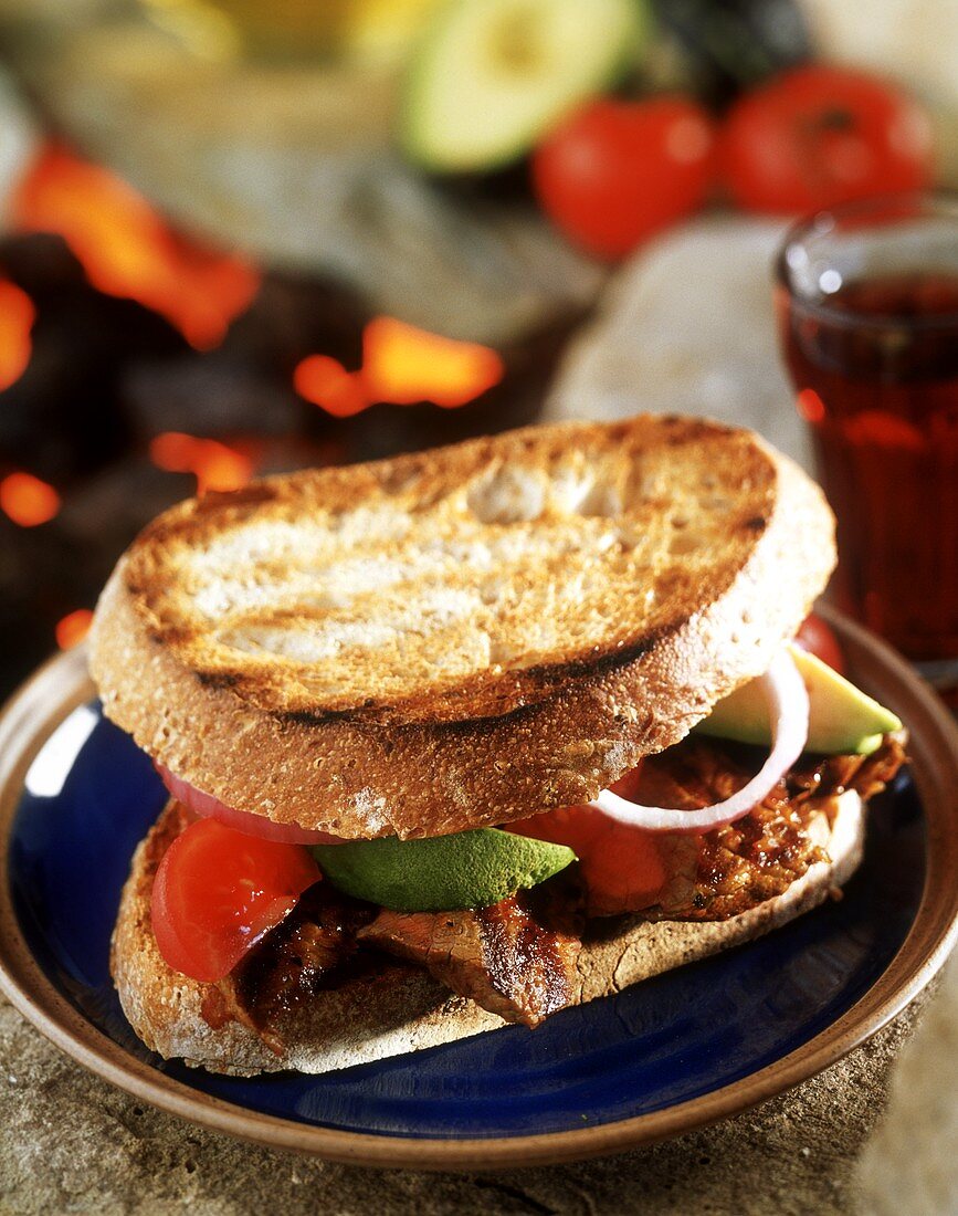Toasted beef, tomato and avocado sandwich
