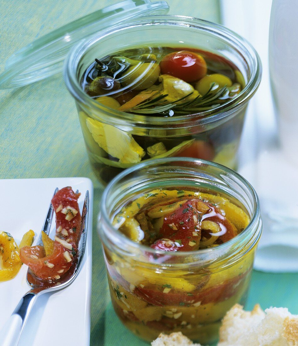 Pickled vegetables (behind) and marinated peppers