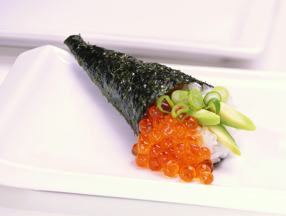 Temaki-sushi with salmon caviare and avocado