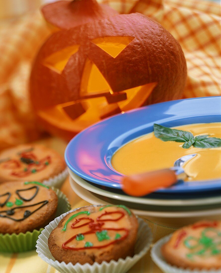 Pumpkin soup & Halloween muffins with pumpkin in background