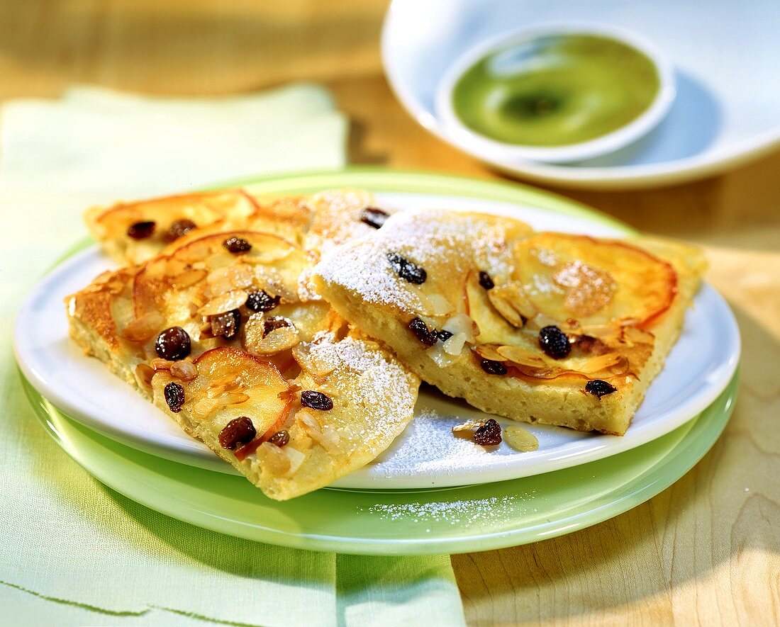 Sweet apple pancakes with raisins & flaked almonds