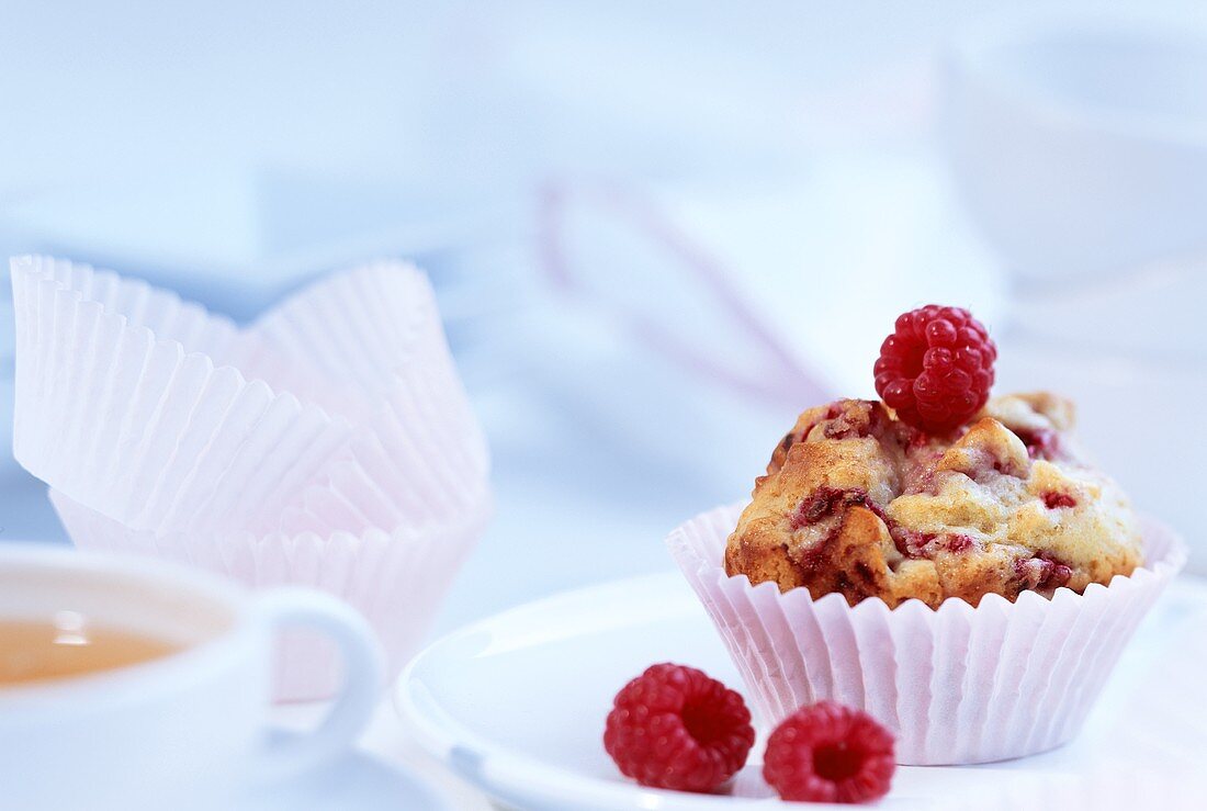 Almond and raspberry muffins on a plate