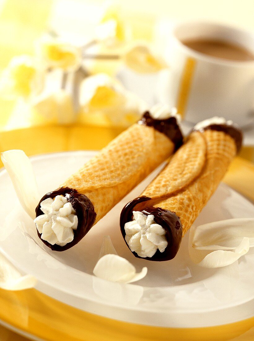 Two cannelons (wafer rolls filled with cream)